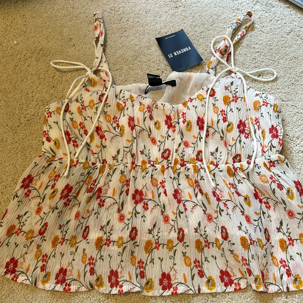 White flowy top with floral detailing